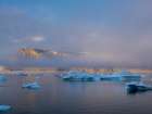 Midnight sun at Storoen Island. Uummannaq Fjord, northwest of Greenland beyond the arctic circle. Art Print
